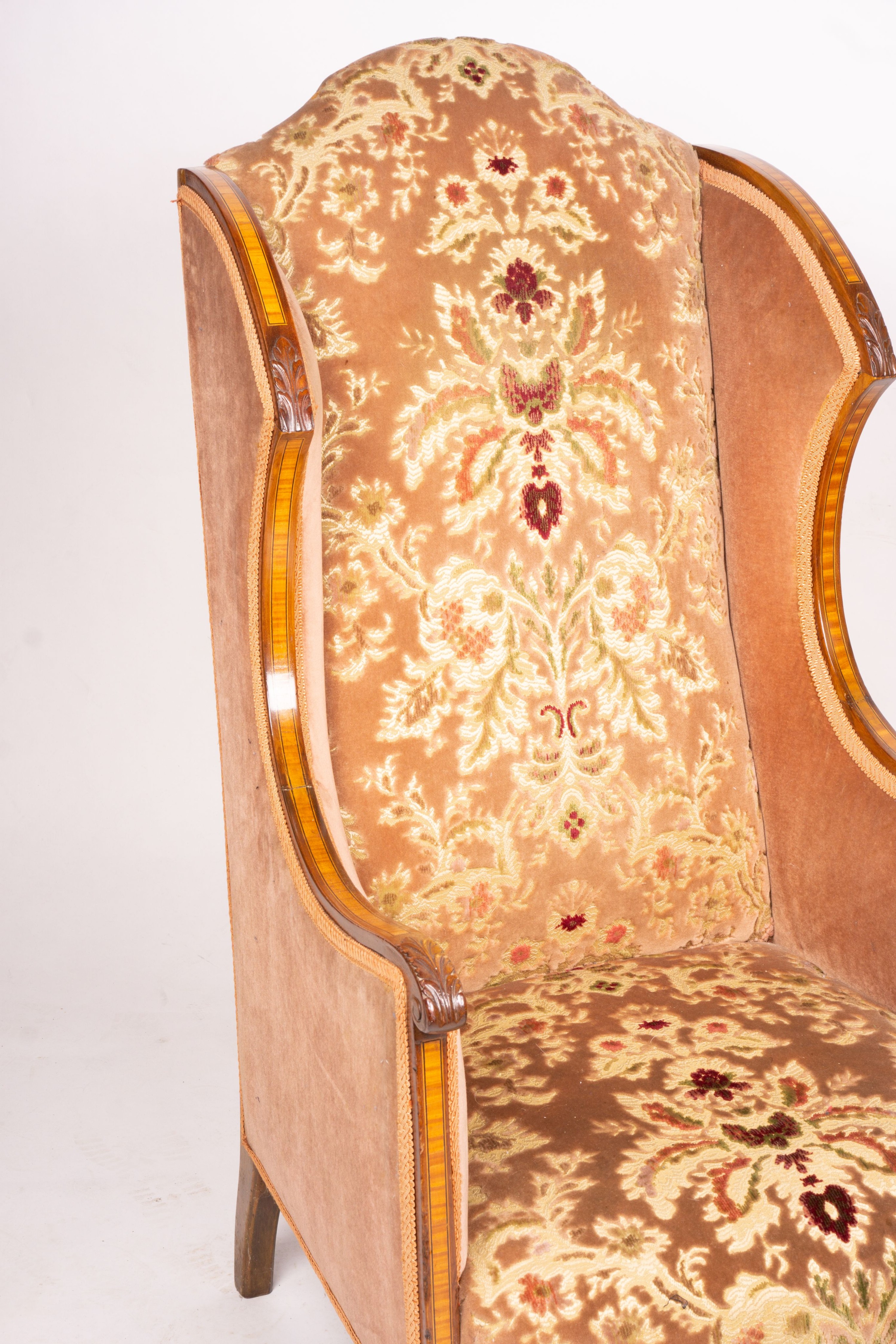 A pair of Edwardian satinwood banded mahogany wing armchairs, width 56cm, depth 75cm, height 110cm